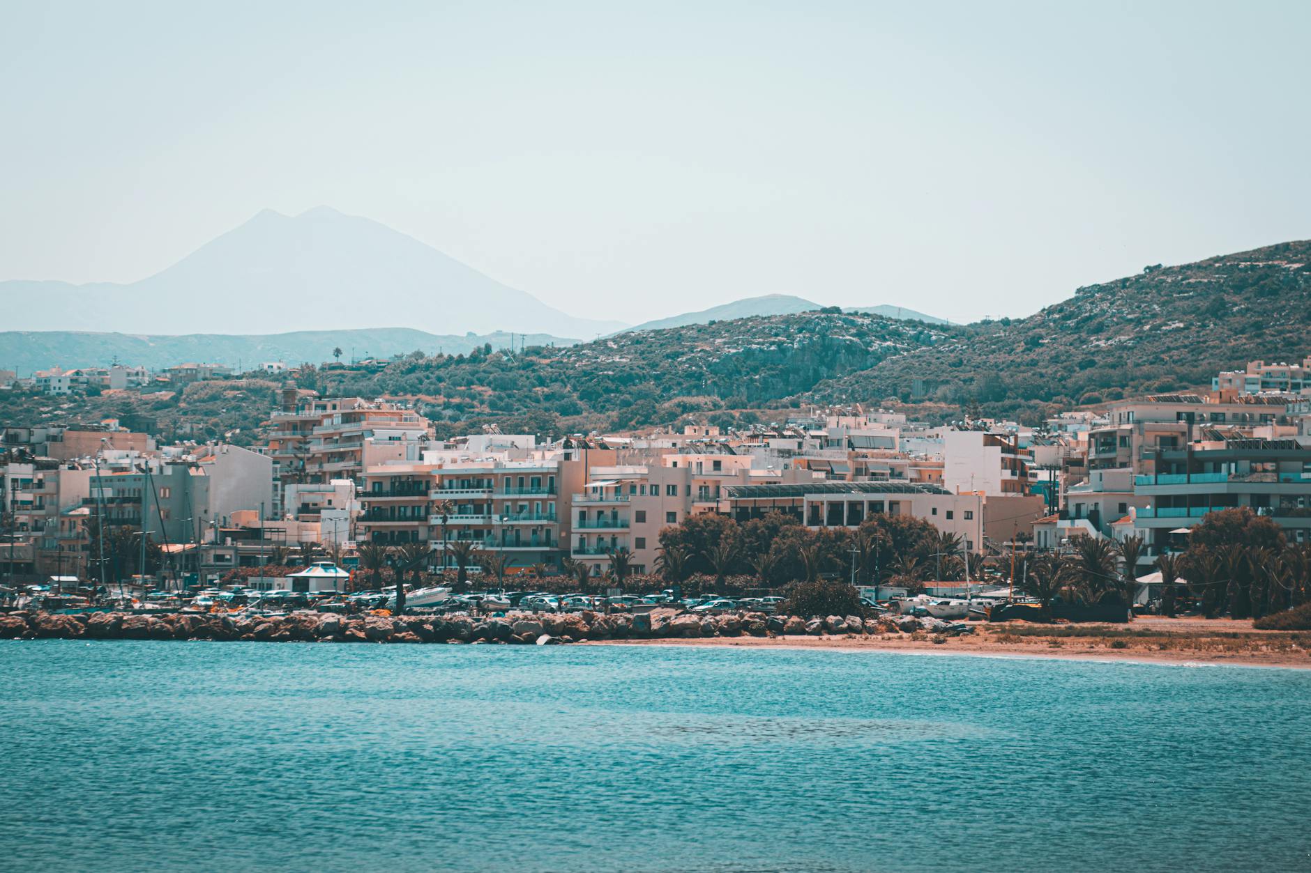 Whitewashed buildings and blue ocean in a Greek coastal village