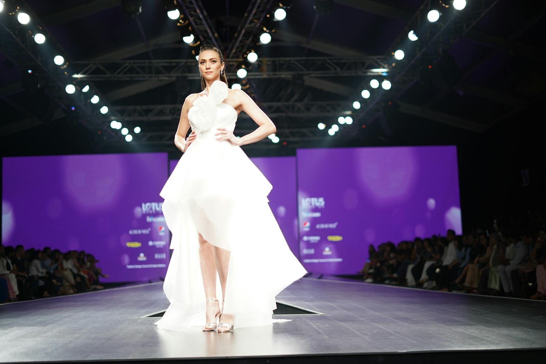 Models walking on fashion runway showcasing avant-garde footwear designs at luxury fashion show
