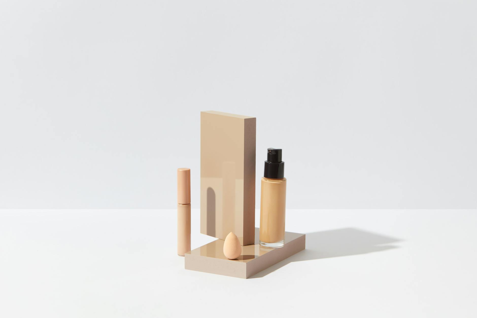 Luxury beauty and fragrance products displayed on clean white background