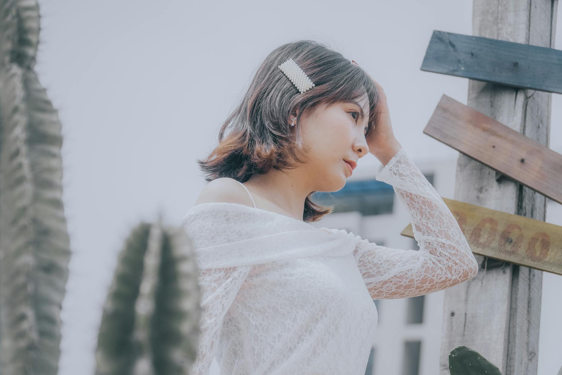 Delicate white hair accessories arranged on styling surface