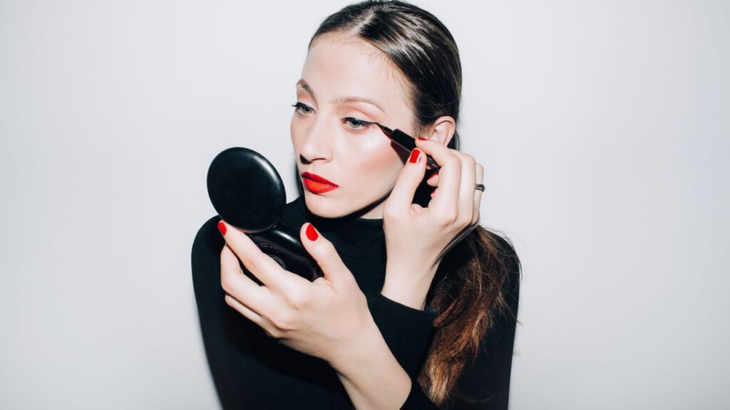 Professional makeup brushes and beauty tools arranged on clean surface