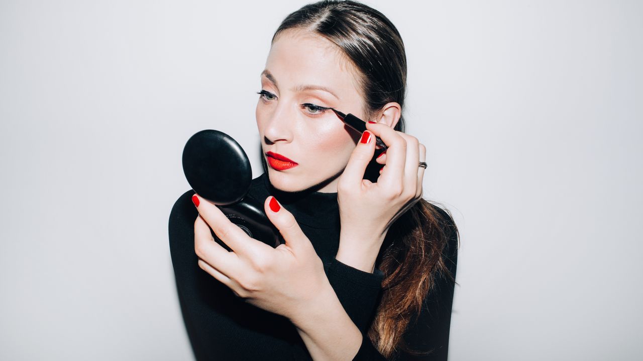 Professional makeup brushes and beauty tools arranged on clean surface