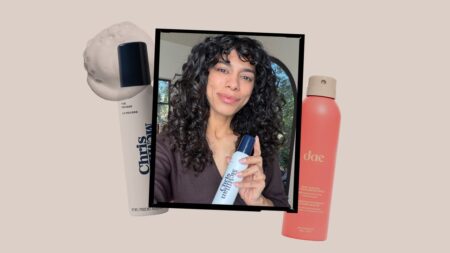 Professional hair volumizing products and styling tools on white background
