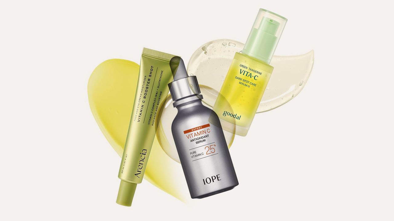 Clear glass dropper bottle containing vitamin C serum on clean white surface