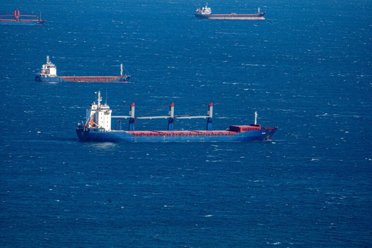 Hormuz Shipping Freeze Holds Despite U.S.-Iran Deal Signing Large cargo ship navigating open ocean waters under overcast sky