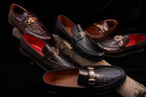 Close-up of luxury men's dress shoes on a runway surface