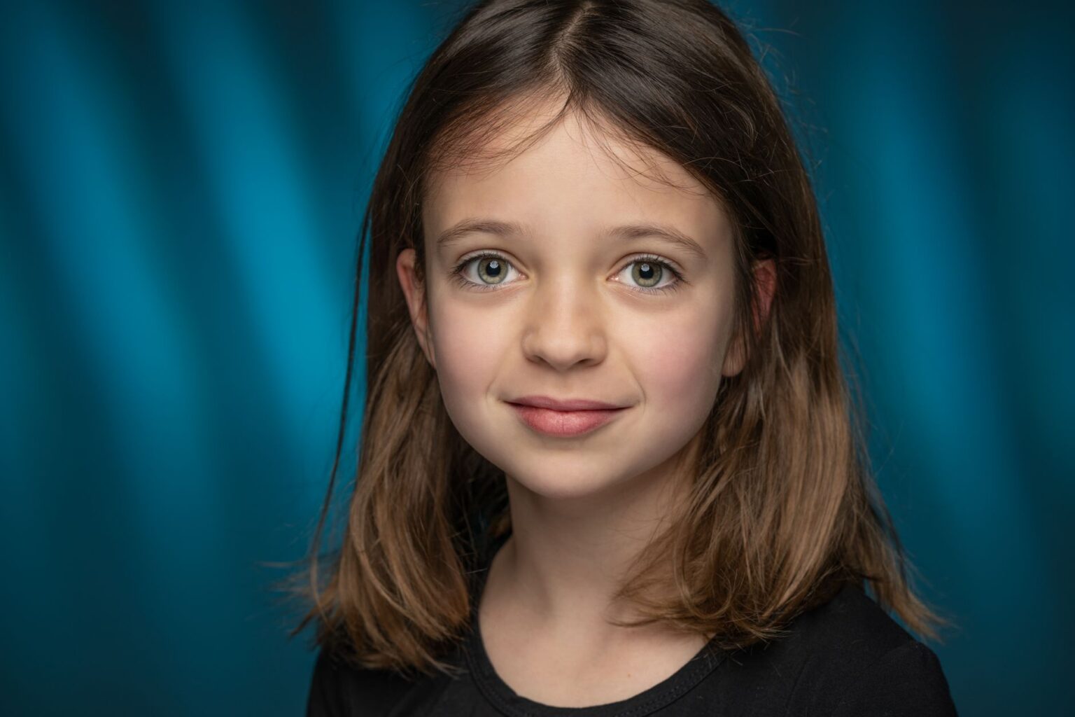Elizabeth Yu Built a Villain. Now She Wants Something Harder. Young actress in dramatic lighting, serious expression