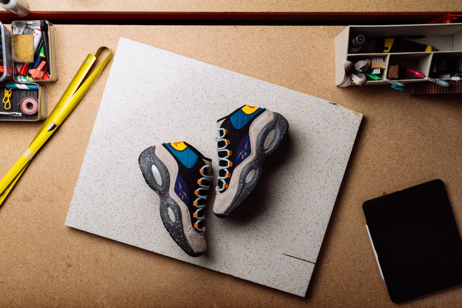 Asics Taps Empty Behavior to Celebrate Chinese Creativity in Paris Close-up of experimental sneaker design in a creative studio setting