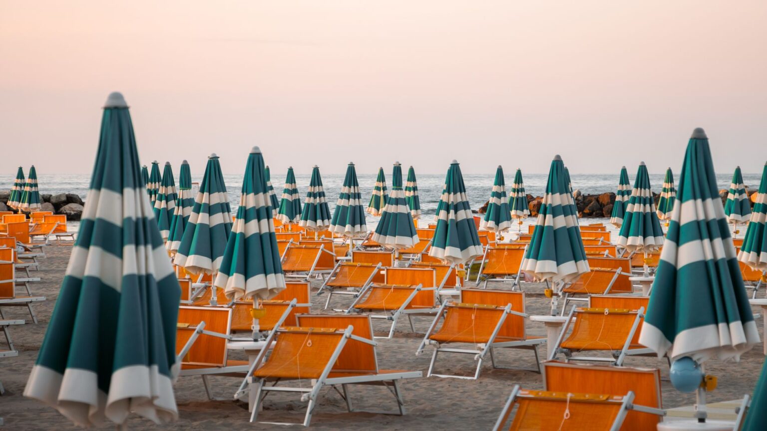 Giacomo Milano Takes Its Milanese Dining Identity to Forte dei Marmi Elegant Italian beach club terrace overlooking the sea on a sunny summer day