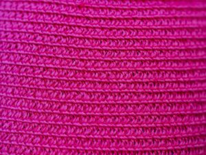 Close-up of a knit-upper athletic sneaker showing woven textile construction