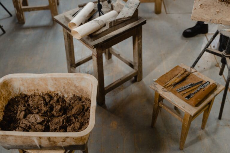 Artisan working at a traditional English pottery wheel in a heritage workshop