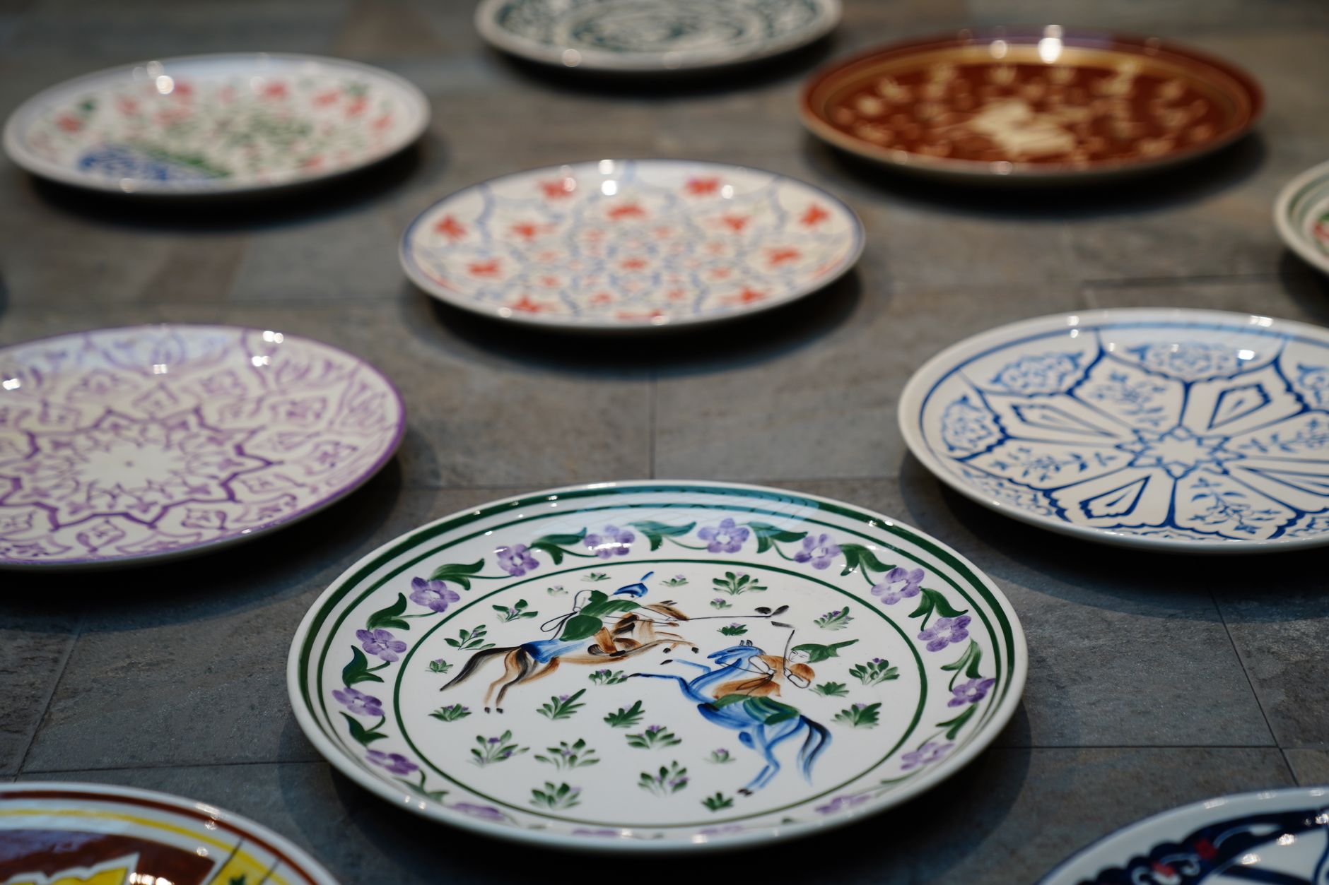 Close-up of intricately patterned ceramic plates in a Victorian-style design