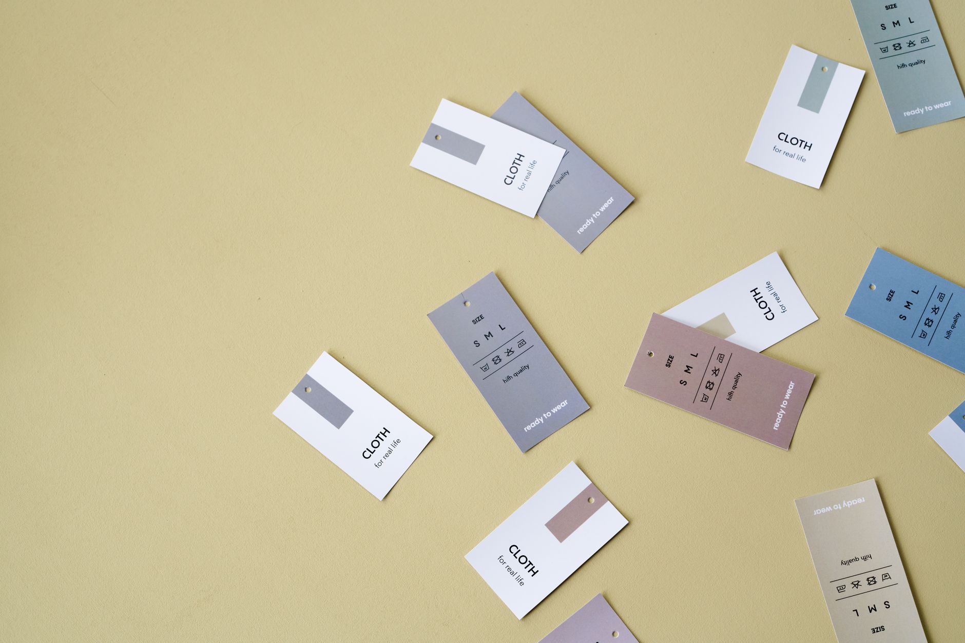 Close-up of garment hang tags with sustainability and care information