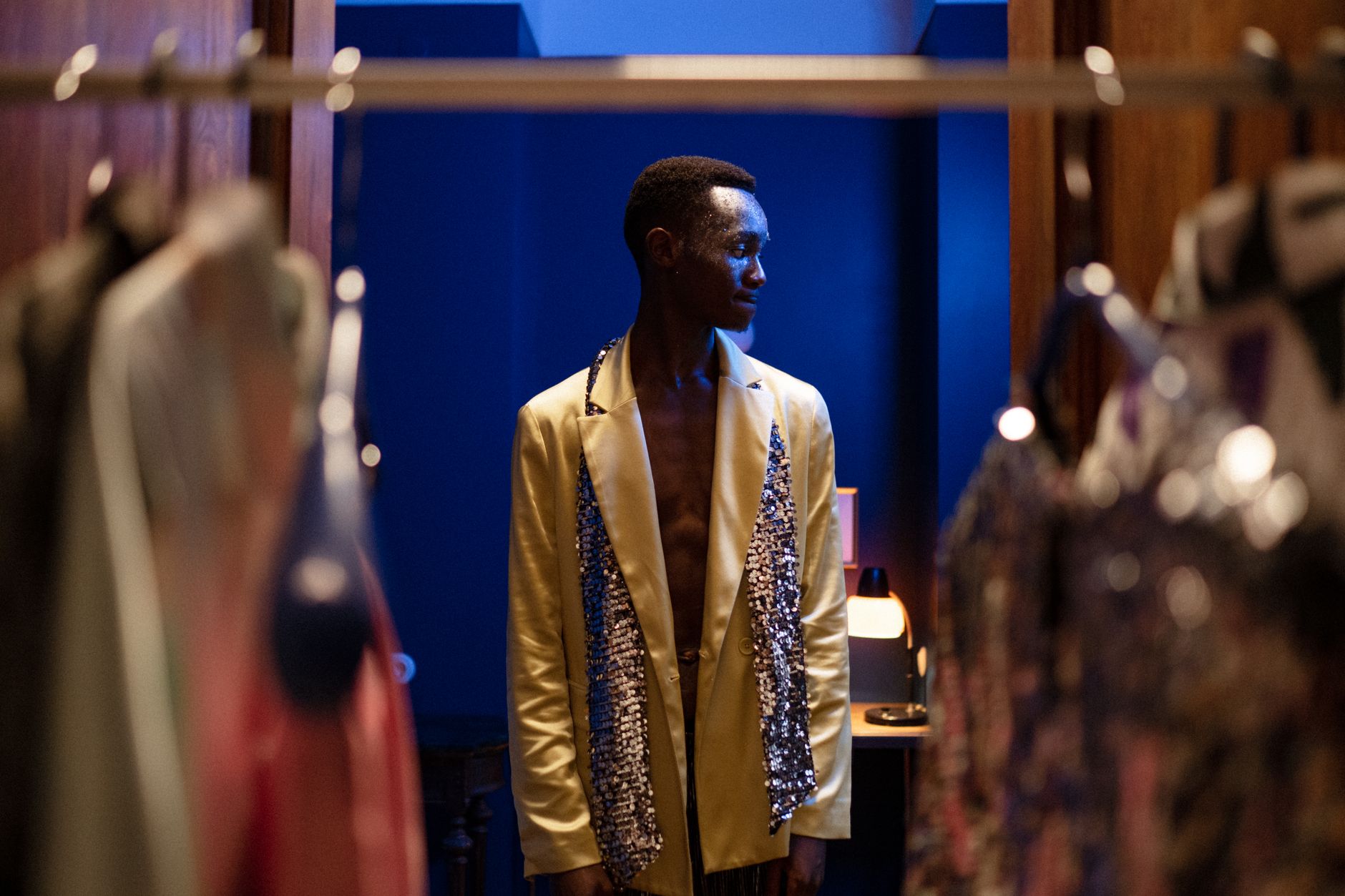 Male model walking a fashion runway in tailored menswear