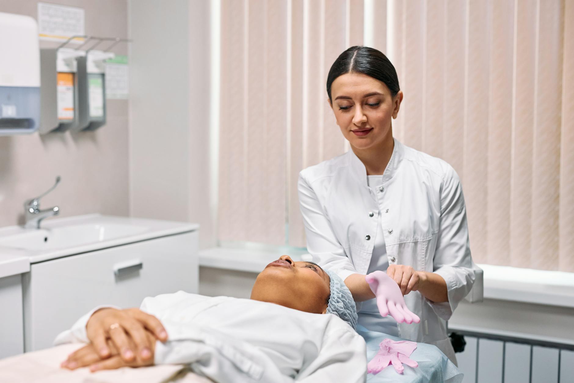 A patient consulting with a dermatologist in a clinical setting