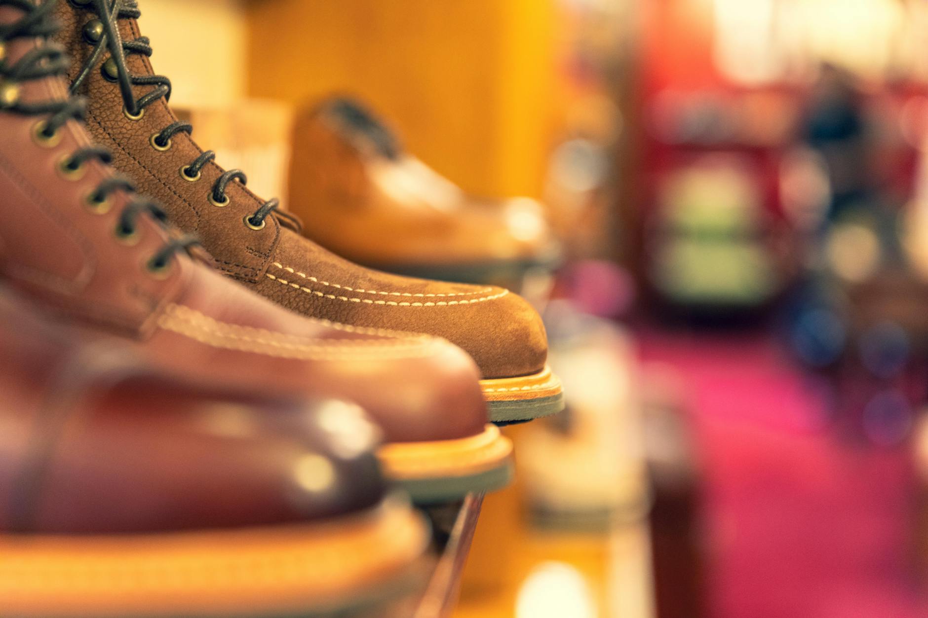 Curated footwear displayed on clean shelving in a minimalist boutique