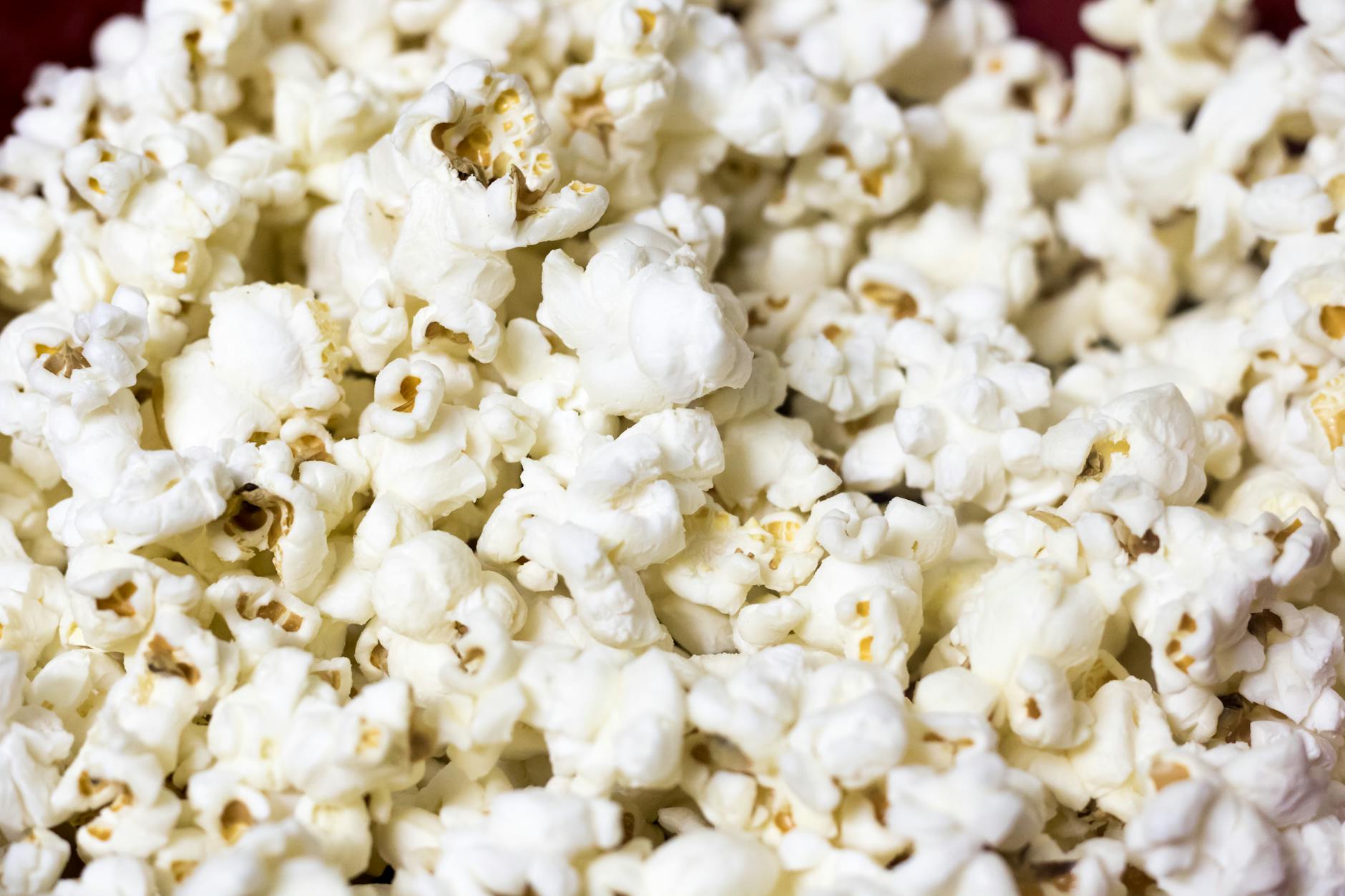Popcorn and cinema snacks on a theater seat