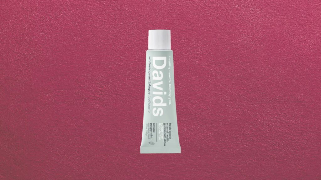 Premium toothpaste tube displayed on a clean marble bathroom counter