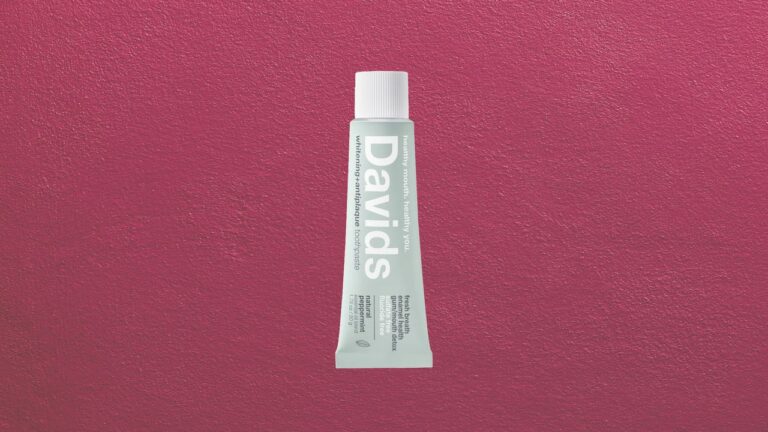 Premium toothpaste tube displayed on a clean marble bathroom counter