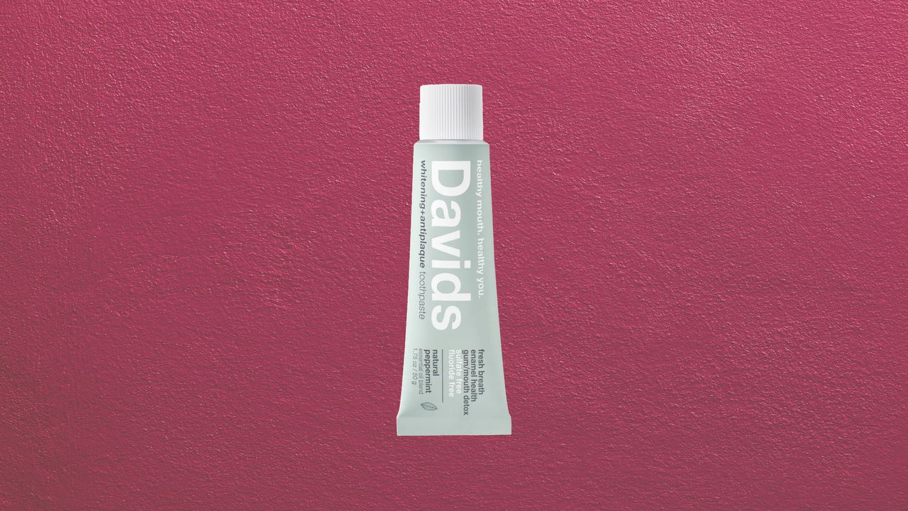 Premium toothpaste tube displayed on a clean marble bathroom counter