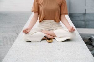 A person practicing mindfulness meditation in a calm, softly lit environment
