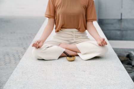 Lila Moss Narrates Sleep Story in Calm-Omnipod Diabetes Wellness Drop A person practicing mindfulness meditation in a calm, softly lit environment