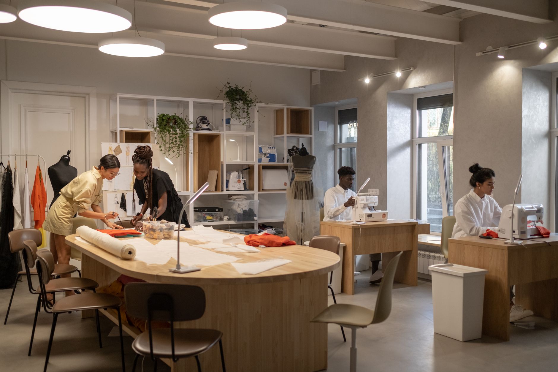 Interior of a high-end fashion atelier with fabric materials and workbenches