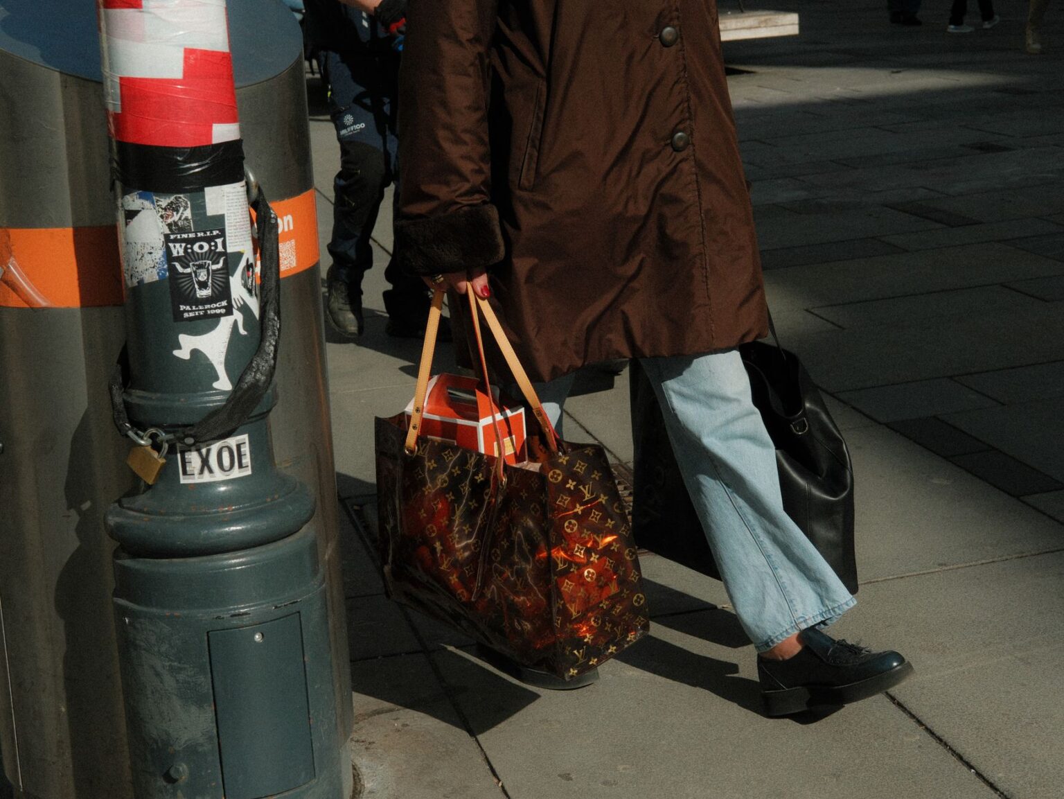 Shopping bags with sneakers representing Foot Locker and Champs Sports back-to-school delivery