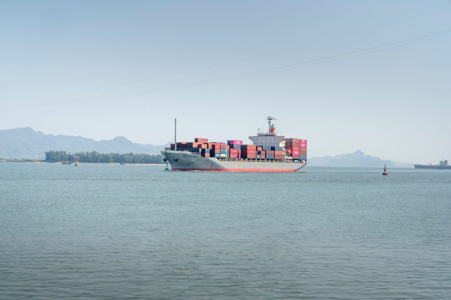 Are Retailers Paying Too Much in Ocean Fuel Surcharges? New Analysis Suggests They Could Be. Large container ship at port carrying retail freight across ocean trade lanes