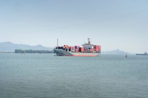 Are Retailers Paying Too Much in Ocean Fuel Surcharges? New Analysis Suggests They Could Be. Large container ship at port carrying retail freight across ocean trade lanes