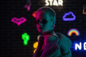 Charli XCX’s Music, Fashion, and Film References Explored A pop artist in minimalist fashion styling backstage at a music event