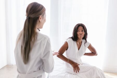 Face Reality Professional Acne Care Delivers Clinical Results Esthetician reviewing a client's skin during a professional acne consultation