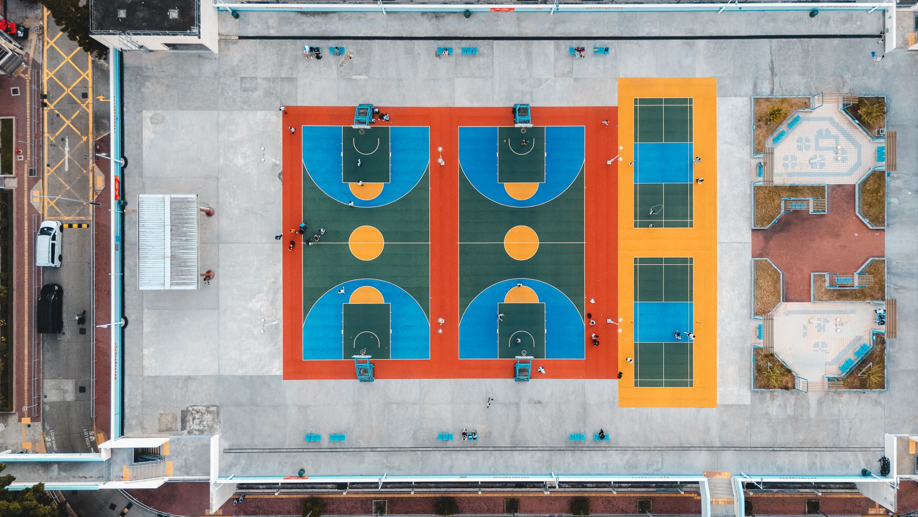 Empty indoor basketball court with hardwood flooring evoking the aesthetic of 1990s NBA arenas