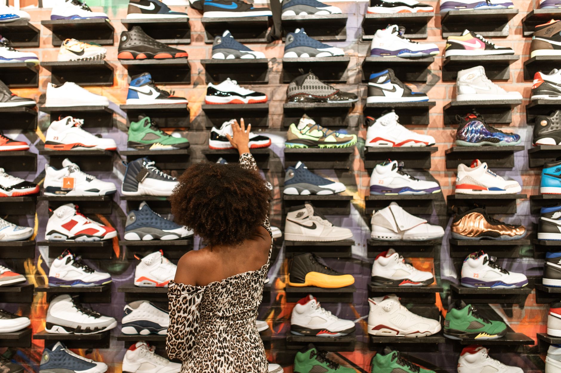 Interior of an upscale sneaker retail space with shoes on display