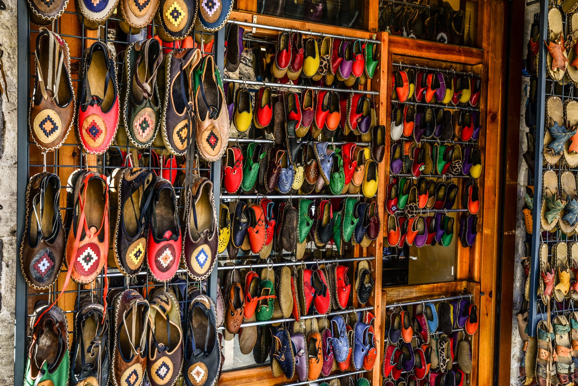 Private label shoes arranged on a retail display shelf