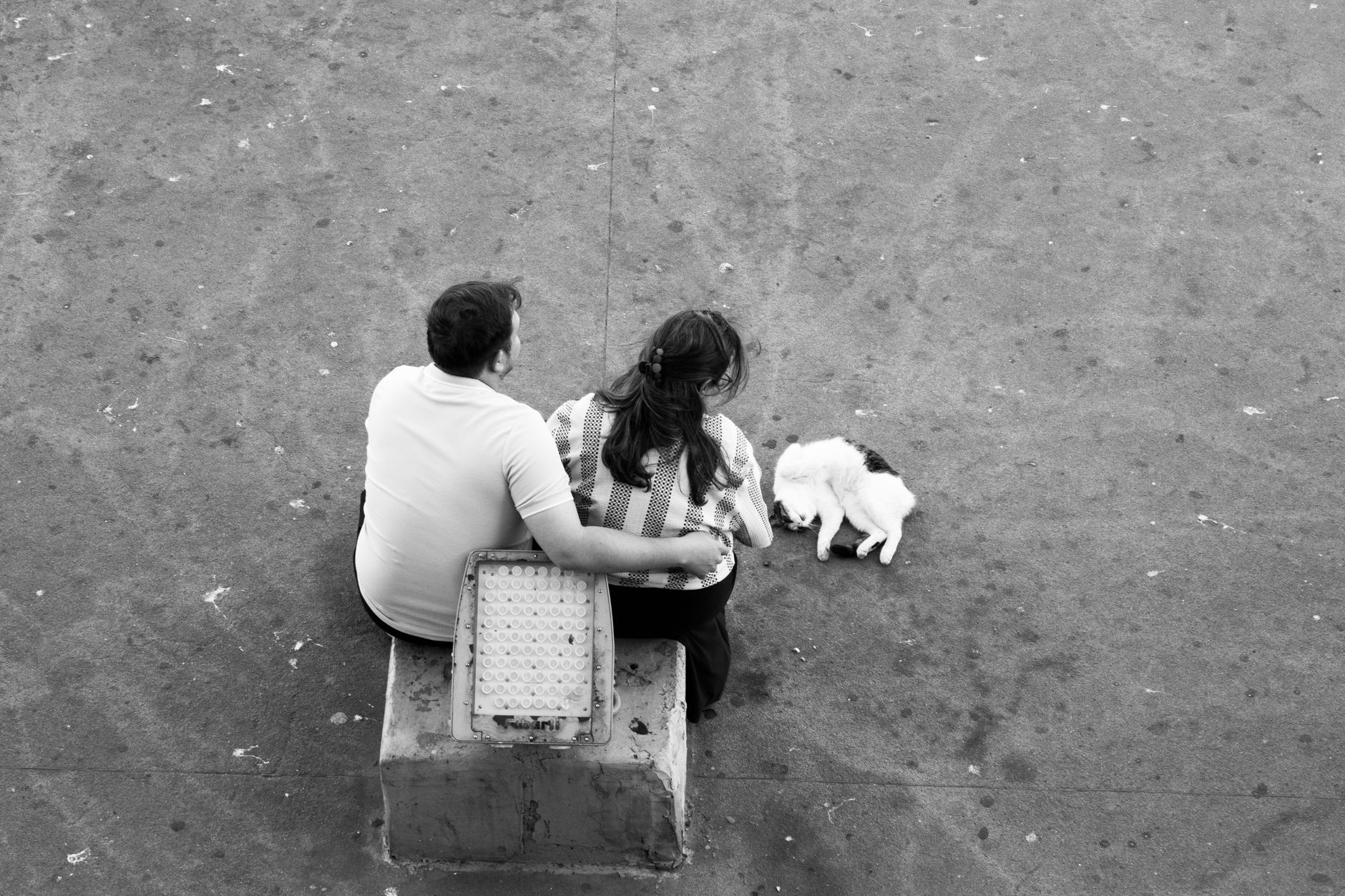 Two people sitting together in comfortable, understated closeness