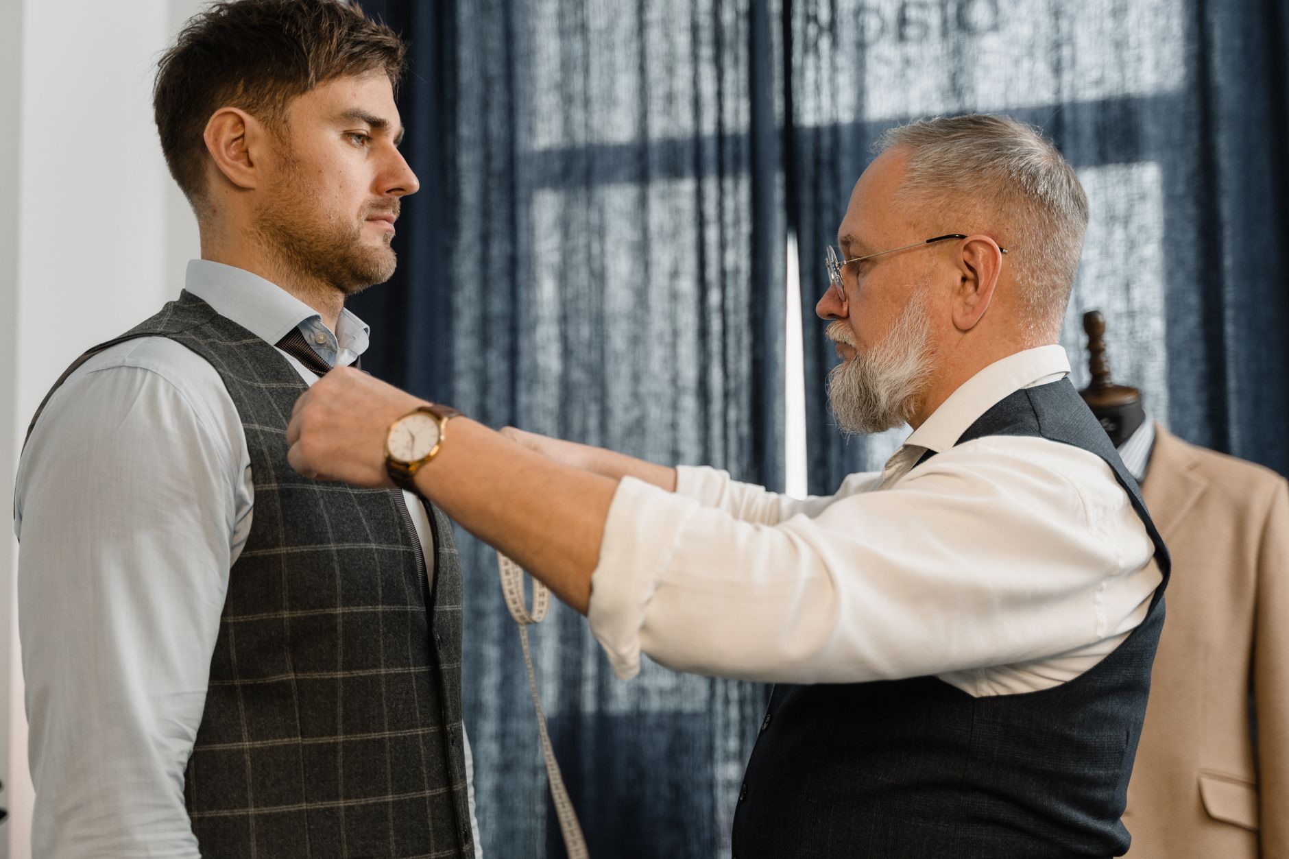 Men in tailored suits representing Hugo Boss menswear positioning