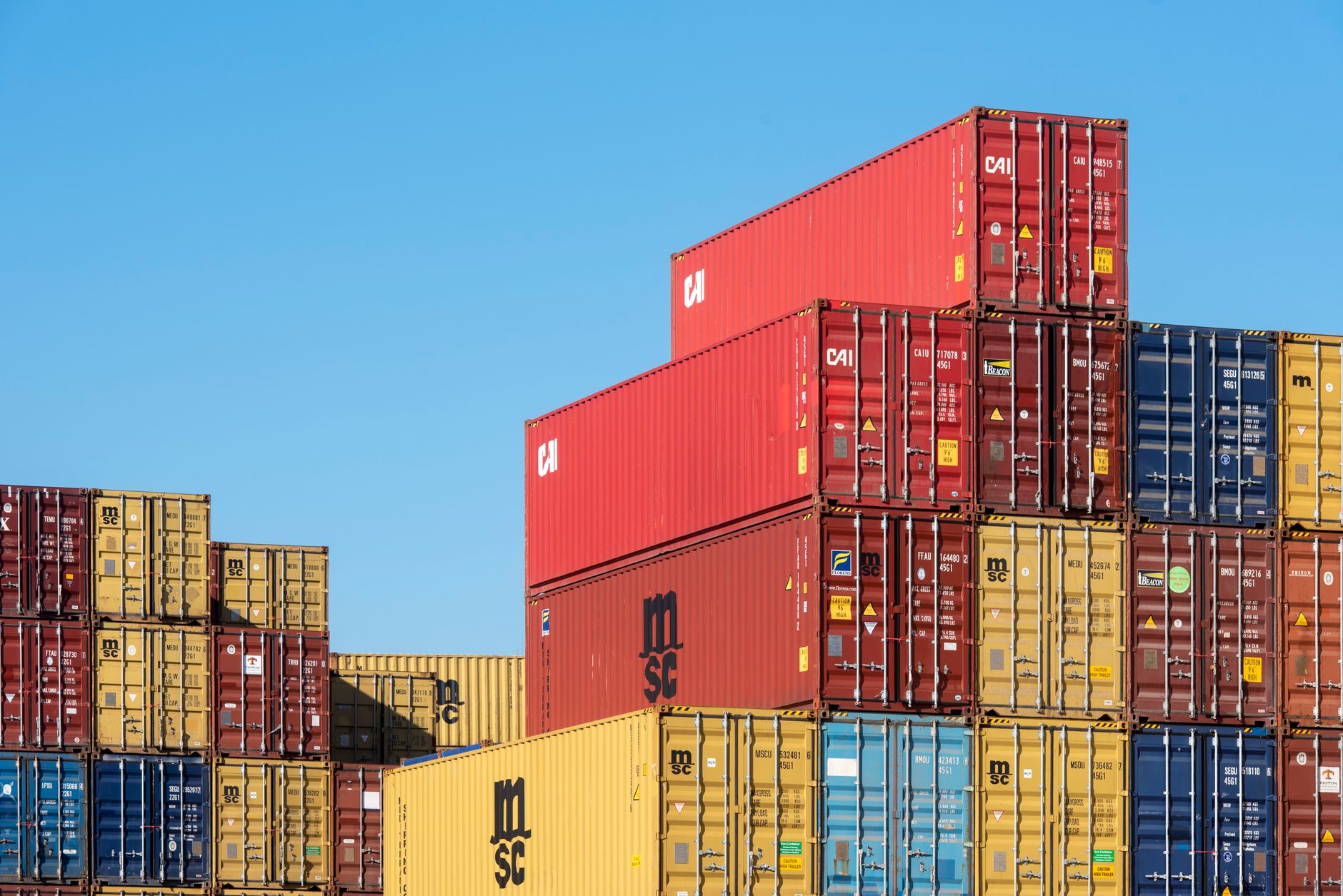 Freight forwarder reviewing shipping documents in a logistics office