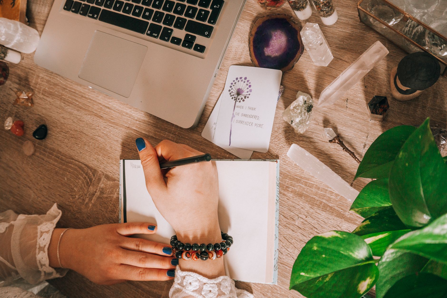 Open journal and pen on a desk, symbolizing manifestation scripting practices