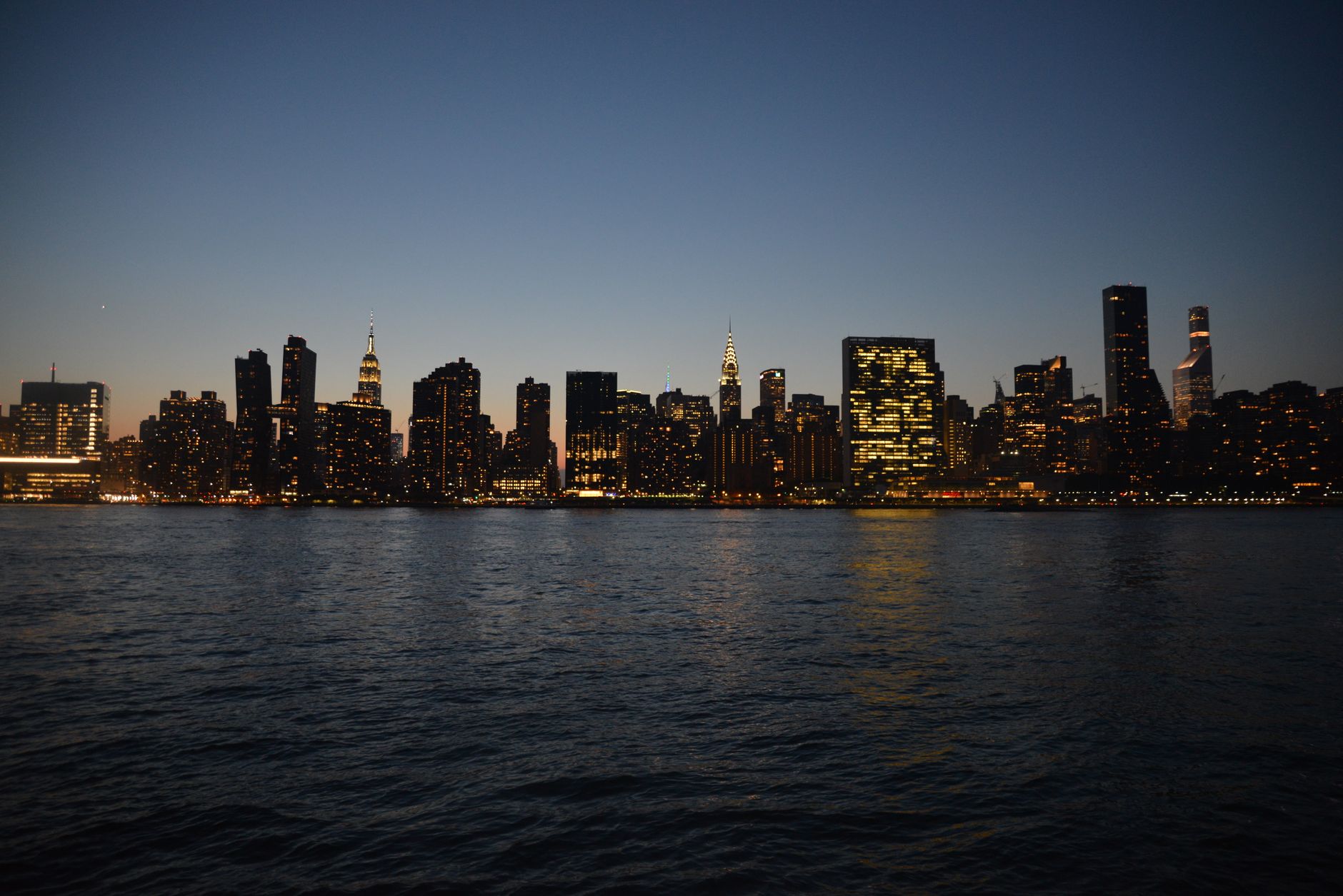 Manhattan skyline viewed from the harbor waterfront during a sailing event