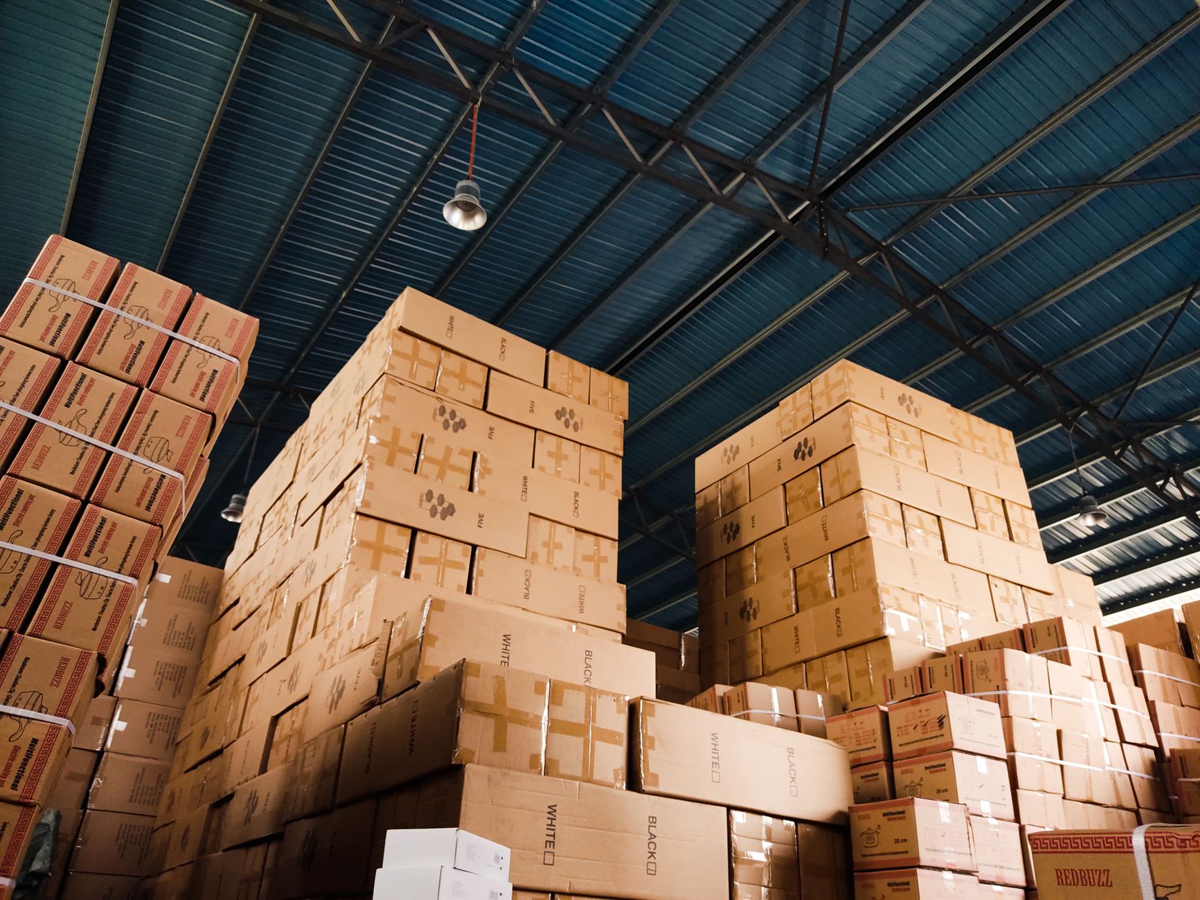 Apparel boxes stacked in a fashion retail distribution warehouse
