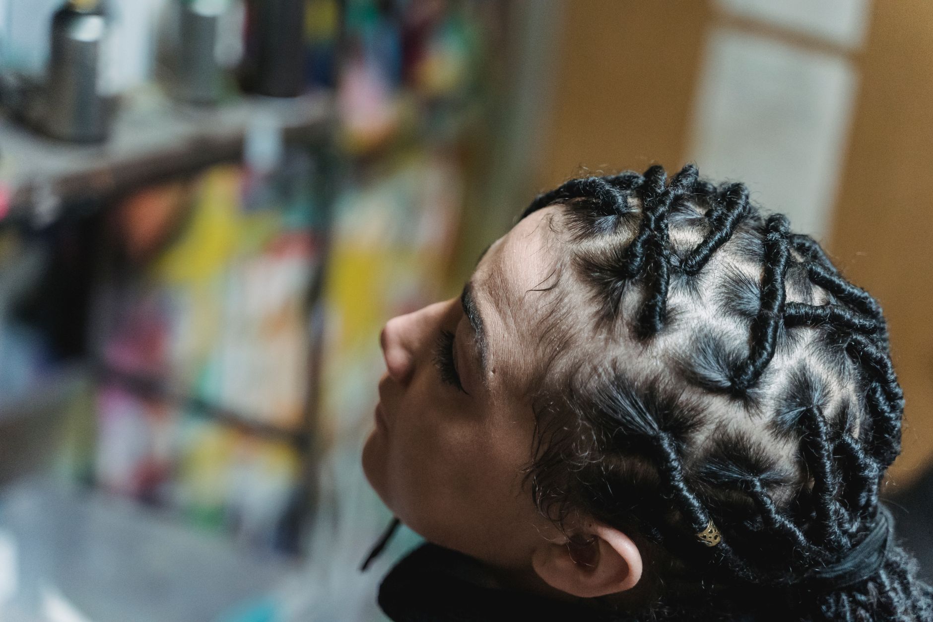 Detailed view of sisterlocks on a model, showcasing the small-diameter locking technique