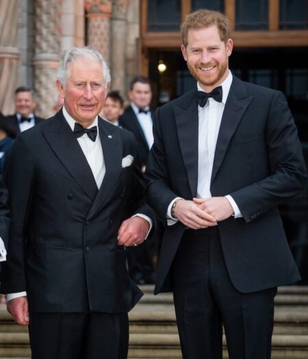 Sussex Family Returns to England Together for First Time Since 2022 A grand English country house surrounded by formal gardens on a clear day