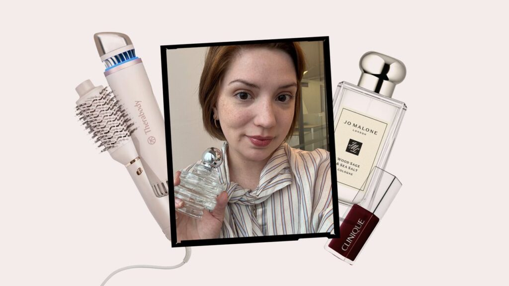 Assorted prestige beauty products including skincare and fragrance arranged on a white surface