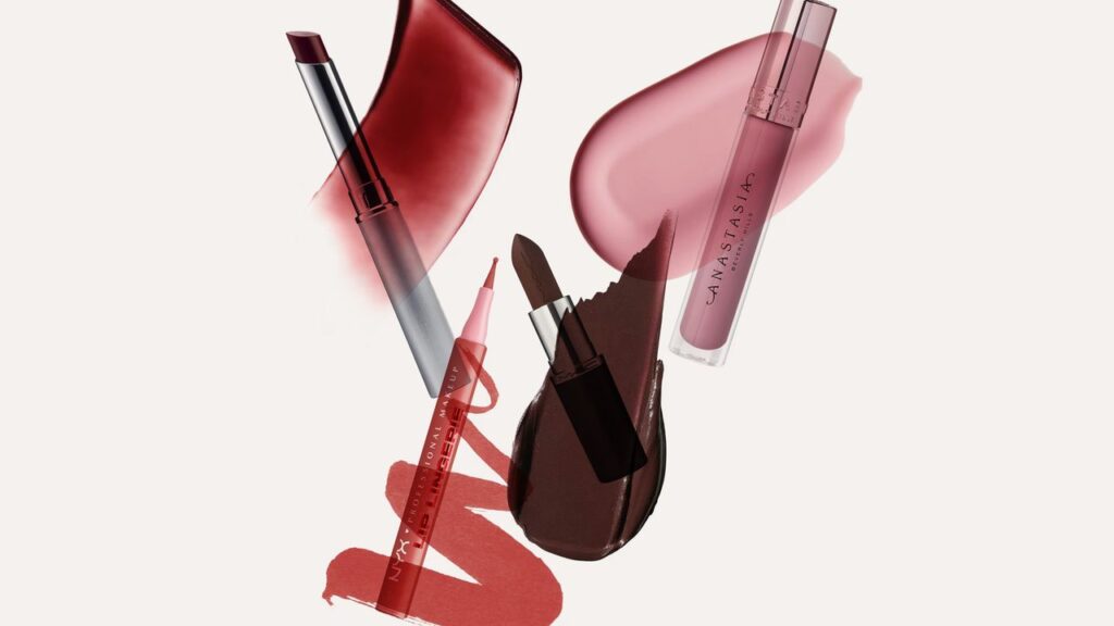 Assorted lipsticks and lip products arranged on a white surface