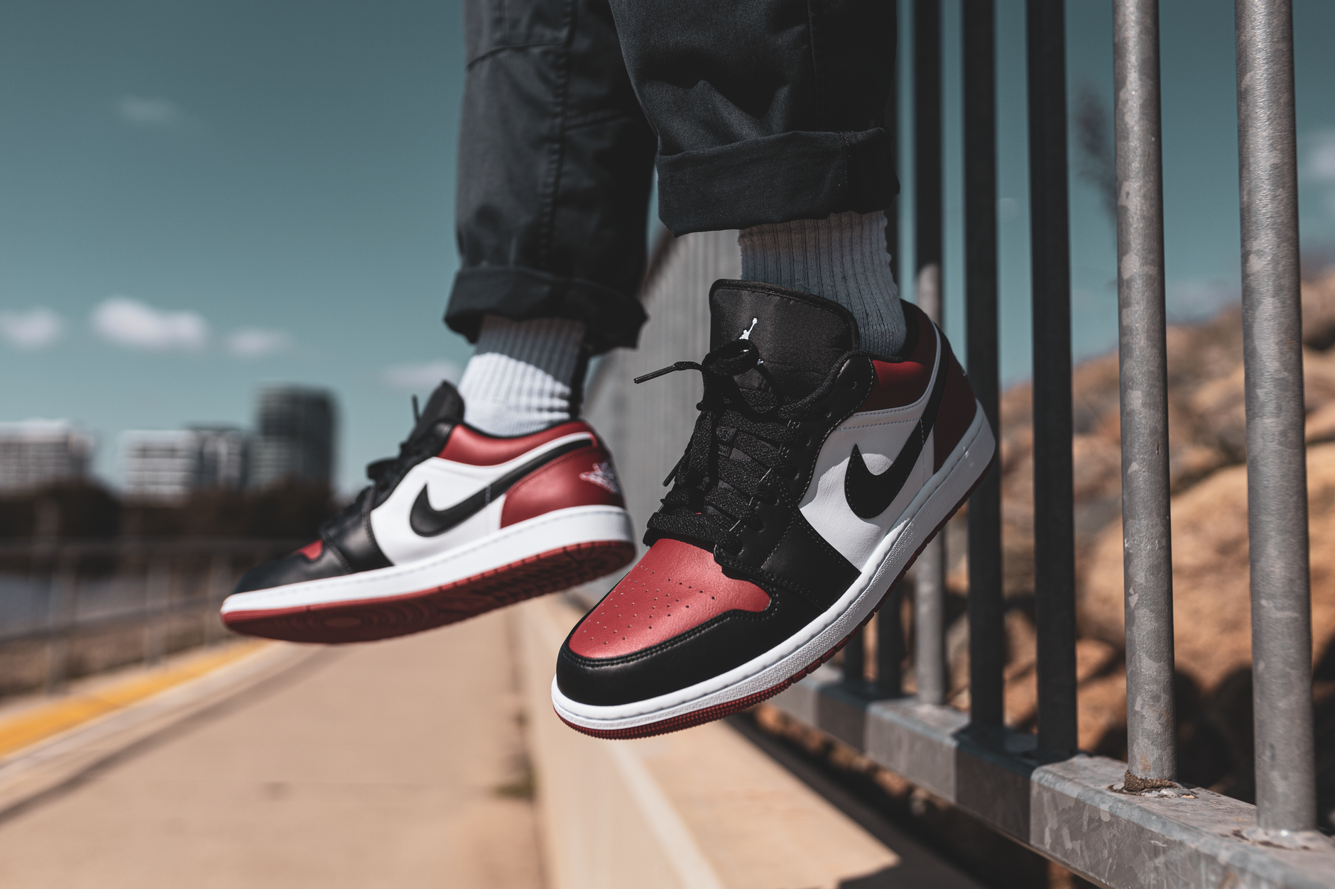 Close-up of red and black athletic sneakers on a clean surface