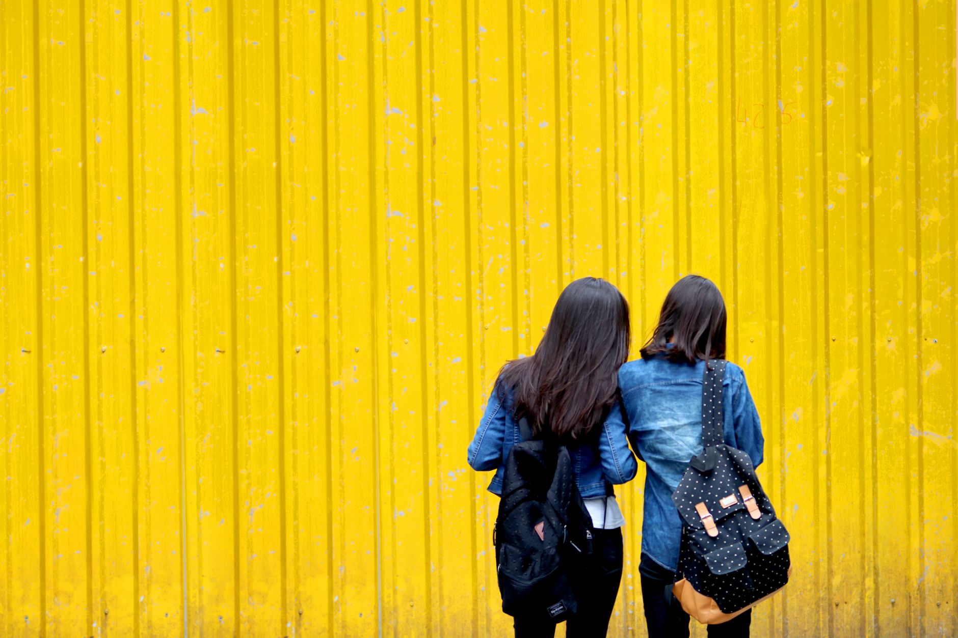 Two stylish women walking together on a New York street during a promotional appearance