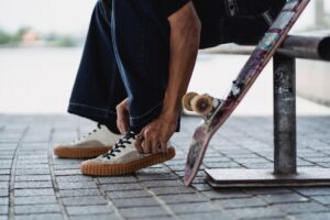 Meet Homies, the Independent Portugal Based Shoe Brand Finding Its Footing in the U.S. Close-up of handcrafted leather shoes displayed on a wooden surface