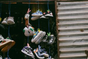 Nike’s ‘One Piece’ Air Max Collaboration Releases Next Month Vibrant limited-edition sneakers arranged on a display surface