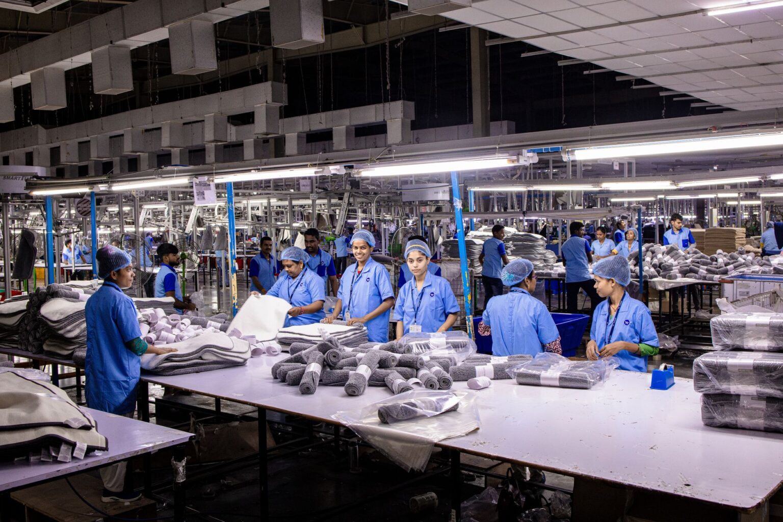 Close-up of sneakers being assembled on a production line in a domestic factory